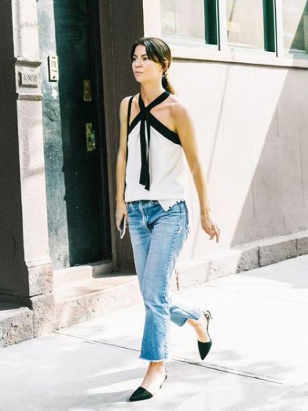 white criss cross-front blouse with ankle jeans and black kitten heels