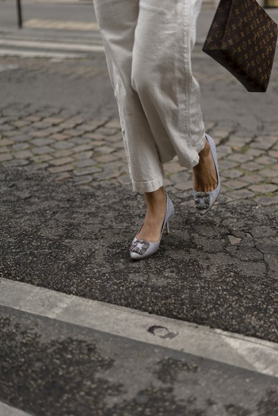 white button up shirt with linen pants and silver blue kitten heels