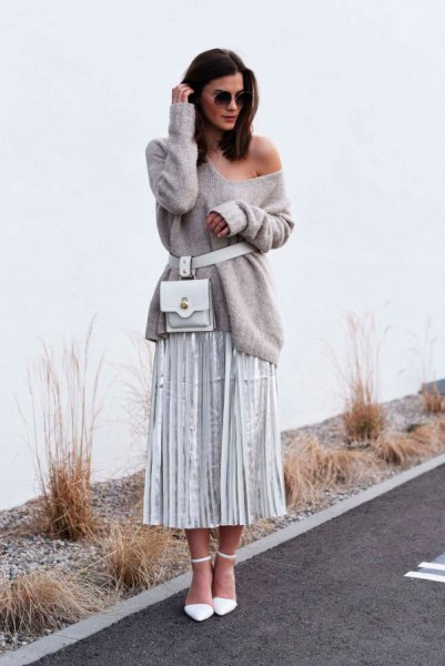 gray sweater with a shoulder belt with pleated midi skirt