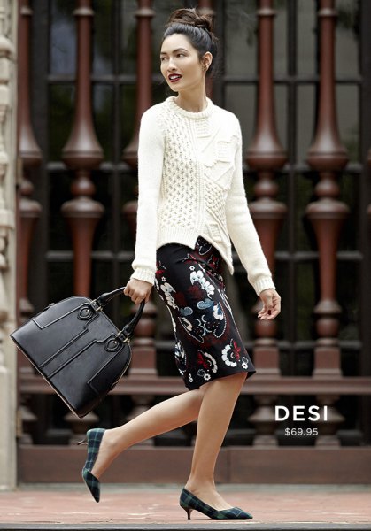 white knit sweater and black floral knee length skirt