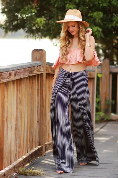 pink pink sleeveless ruffle top with black and white striped pants