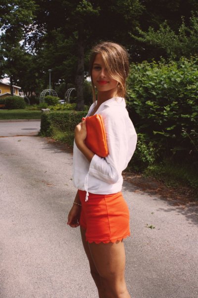 white blouse with orange combed shorts