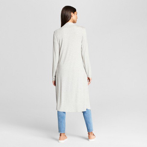 white long midi shawl collar sweater with light blue jeans