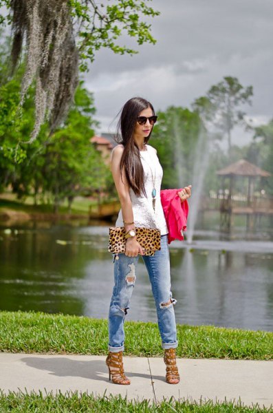 white sleeveless top with boho long necklace and leopard print clutch bag