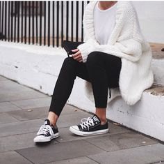 white chunky knit sweater with black ankle jeans