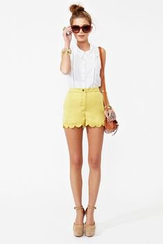 white sleeveless blouse with yellow short in mini shorts