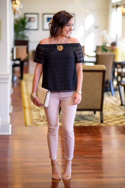 black from shoulder sweater with pale pink jeans