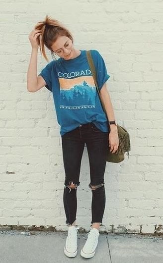 blue print tee with black ripped jeans and high top converse