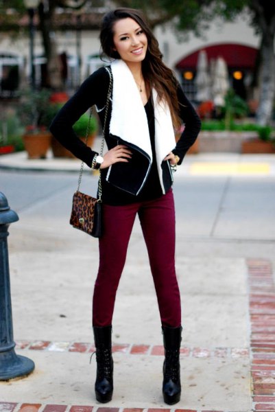 black and white shearling vest with brown skinny jeans and mid calf boots