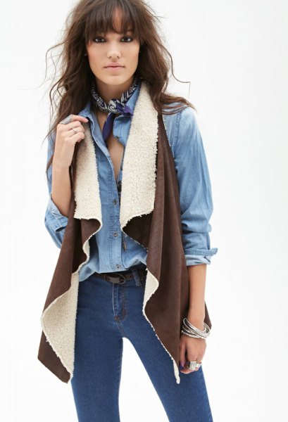 chambray shirt with brown shearling vest skinny jeans