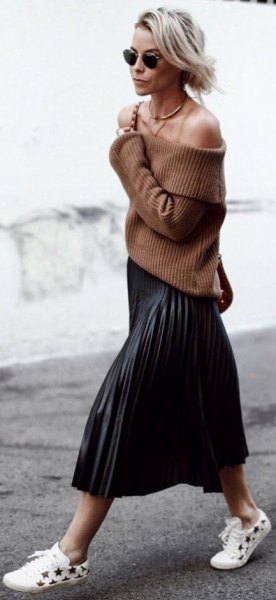 green from shoulder ribbed sweater with black midi-pleated skirt