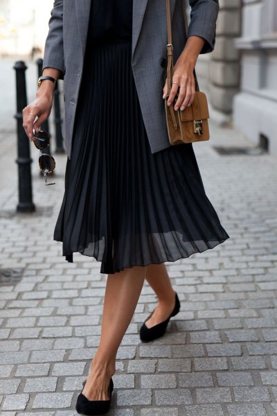 gray suit jacket with sweater and black pleated midi chiffon skirt