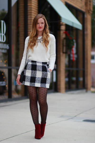 black knitted sweater and black patterned socks