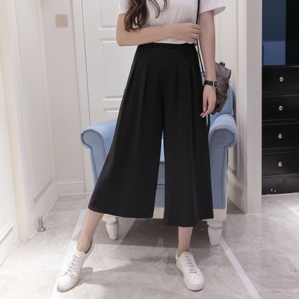 white t-shirt with black suspenders elasticated waist wide pants trousers