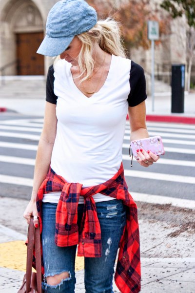 blue denim hat with ripped blue jeans and red checkered shirt