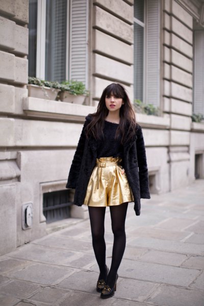 gold flowing shorts with black teddy jacket