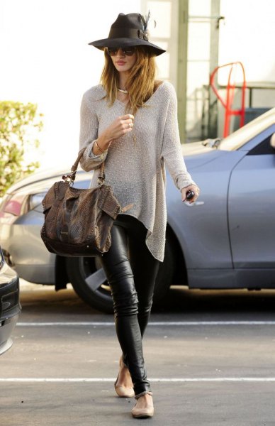 pale pink sweater and black leather leggings