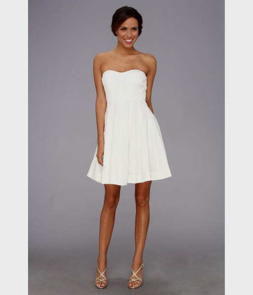 white strapless fit and flare mini dress with strappy heels