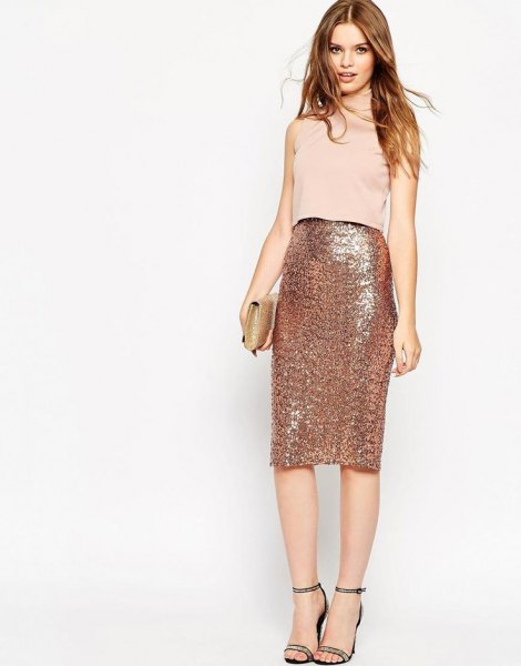 light pink sleeveless top with rose gold midi skirt with high waist