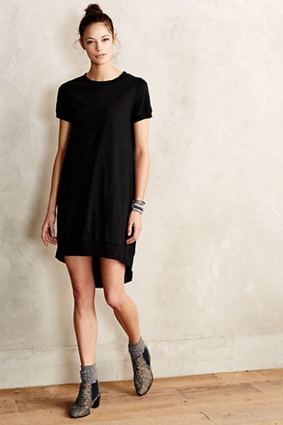 black tunic dress with gray socks and boots