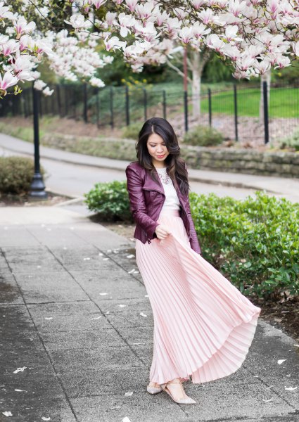 black leather jacket with pale pink maxi pleated skirt