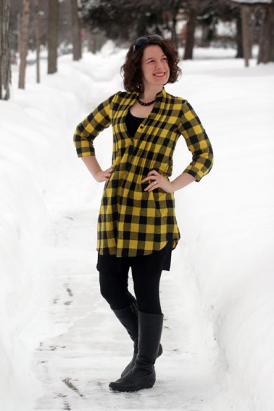 yellow and black checkered top with leggings and knee-high boots