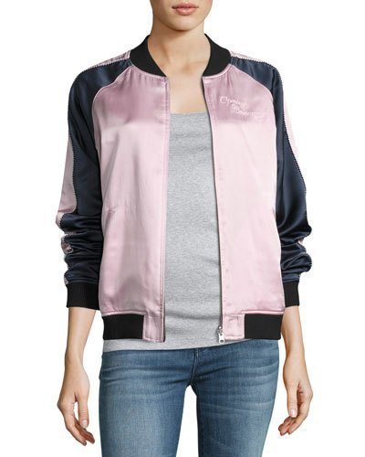 black and white silk bomber jacket with gray tee and blue jeans