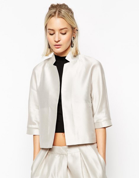 white side jacket with three quarters with black top