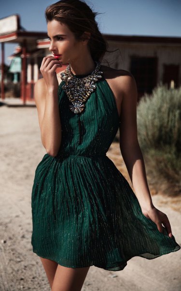 green halter gathered waist mini cocktail dress with statement necklace