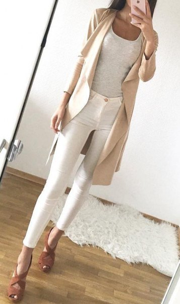 light pink long line with white skinny pants