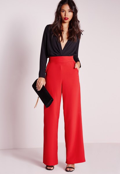 black deep v-neck blouse with red pants with high waist
