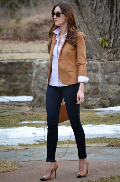 camel blazer with blue button up shirt and black slim jeans