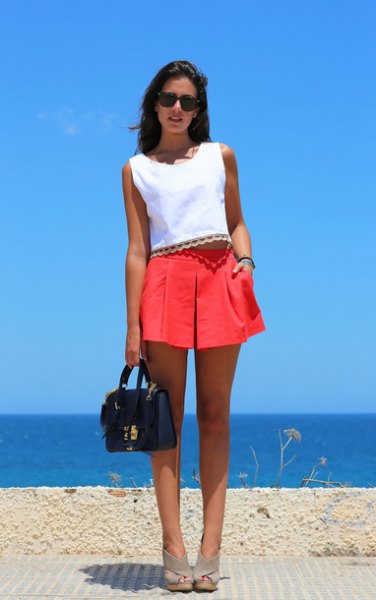 red pleated shorts with white sleeveless top