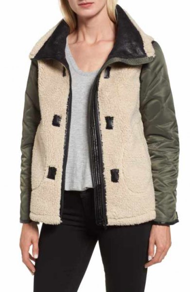 white and gray shearling bomber jacket with black skinny jeans