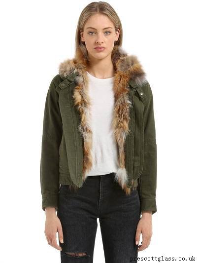 fur lined green denim jacket with black ripped jeans