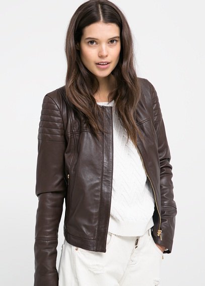 dark brown leather bomber jacket with white jeans with wide legs