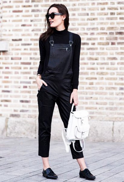 black knit sweater with suede with leather overalls
