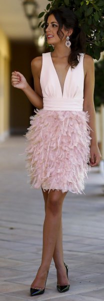 white sleeveless deep v-neck dress with pink feathers