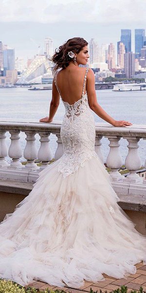 white low back lace and feather long flowing wedding dress