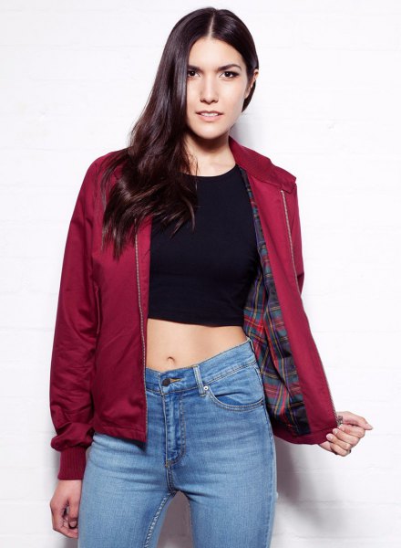 red harrington jacket with black green blue jeans