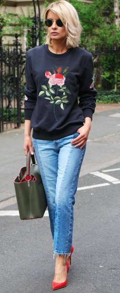 black rose embroidered sweater with blue jeans