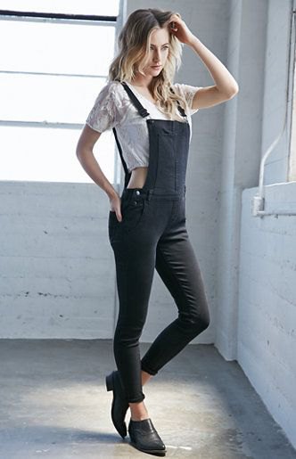 white cropped t-shirt with black skinny overalls
