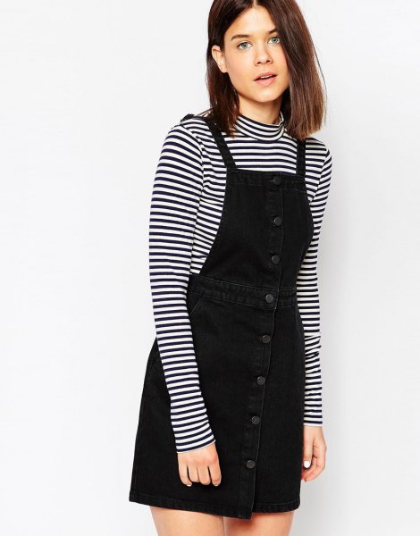 pinafore dress at the front with black and striped long sleeve tee