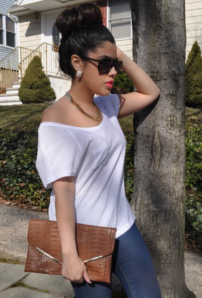 white a shoulder sweater with leather chain necklace