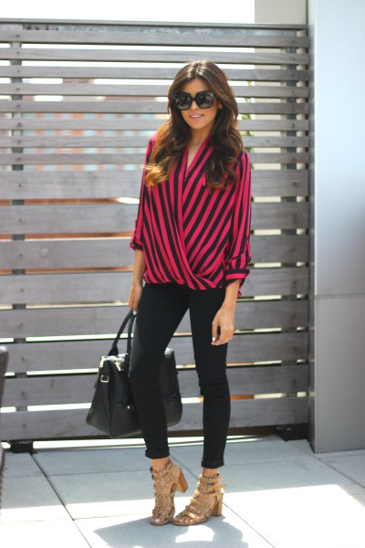 green and black striped wrap blouse and black skinny jeans