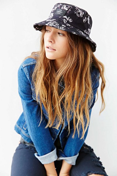 black printed bucket hat with denim jacket and ripped jeans