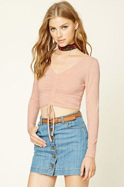 pink v-neck top with denim button front mini skirt