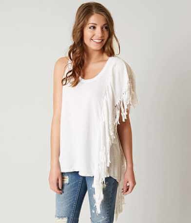 asymmetrical fringed sleeveless top ripped jeans