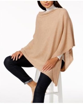ivory cashmere poncho over white sweater with hollow neck