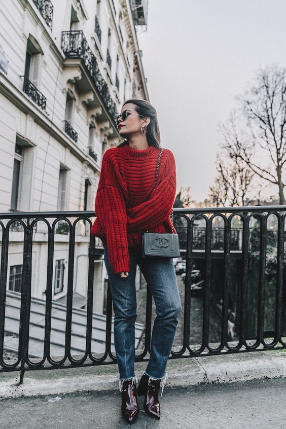 frayed bottom jeans red chunky sweater